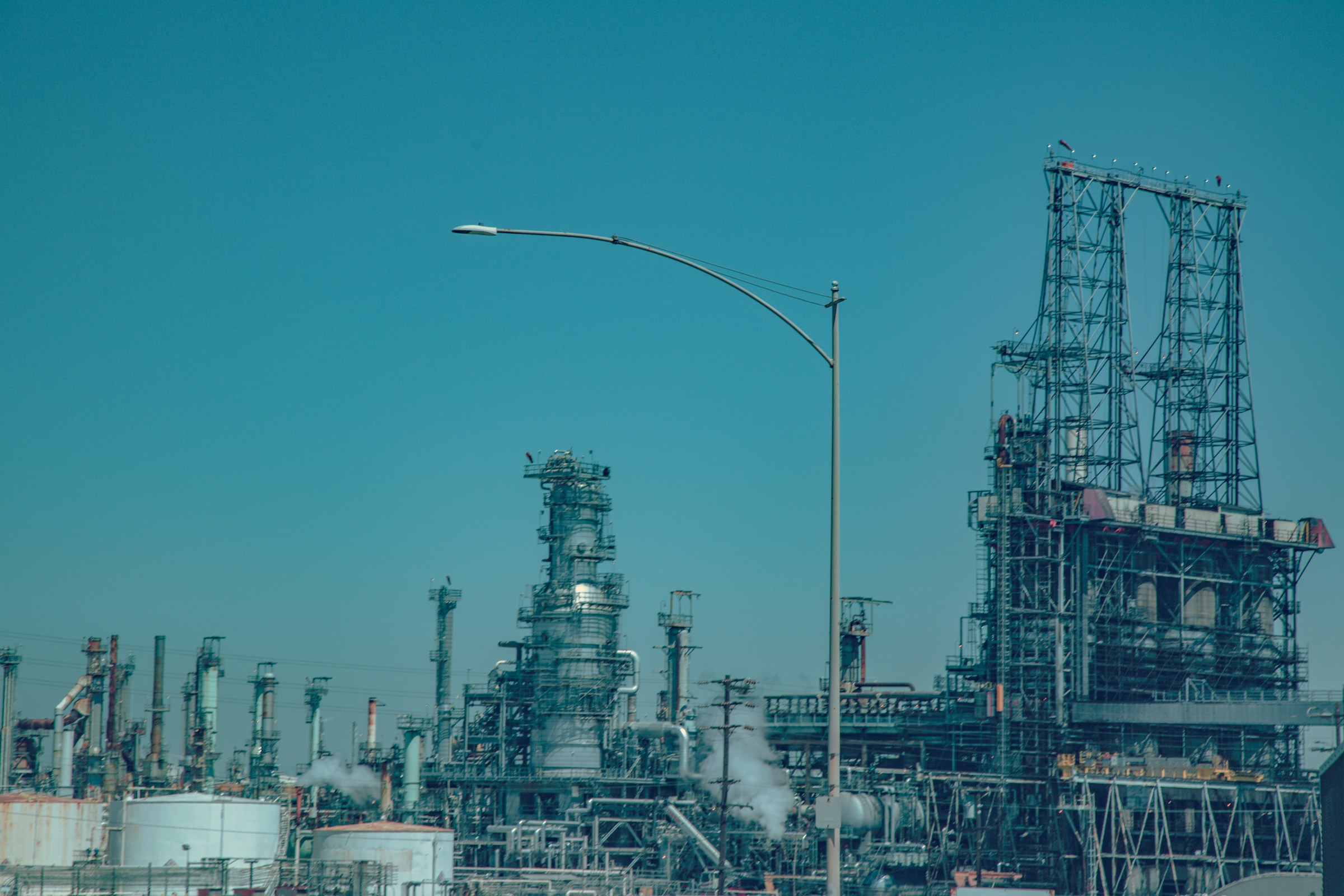 Distillation towers and pipework at an oil refinery